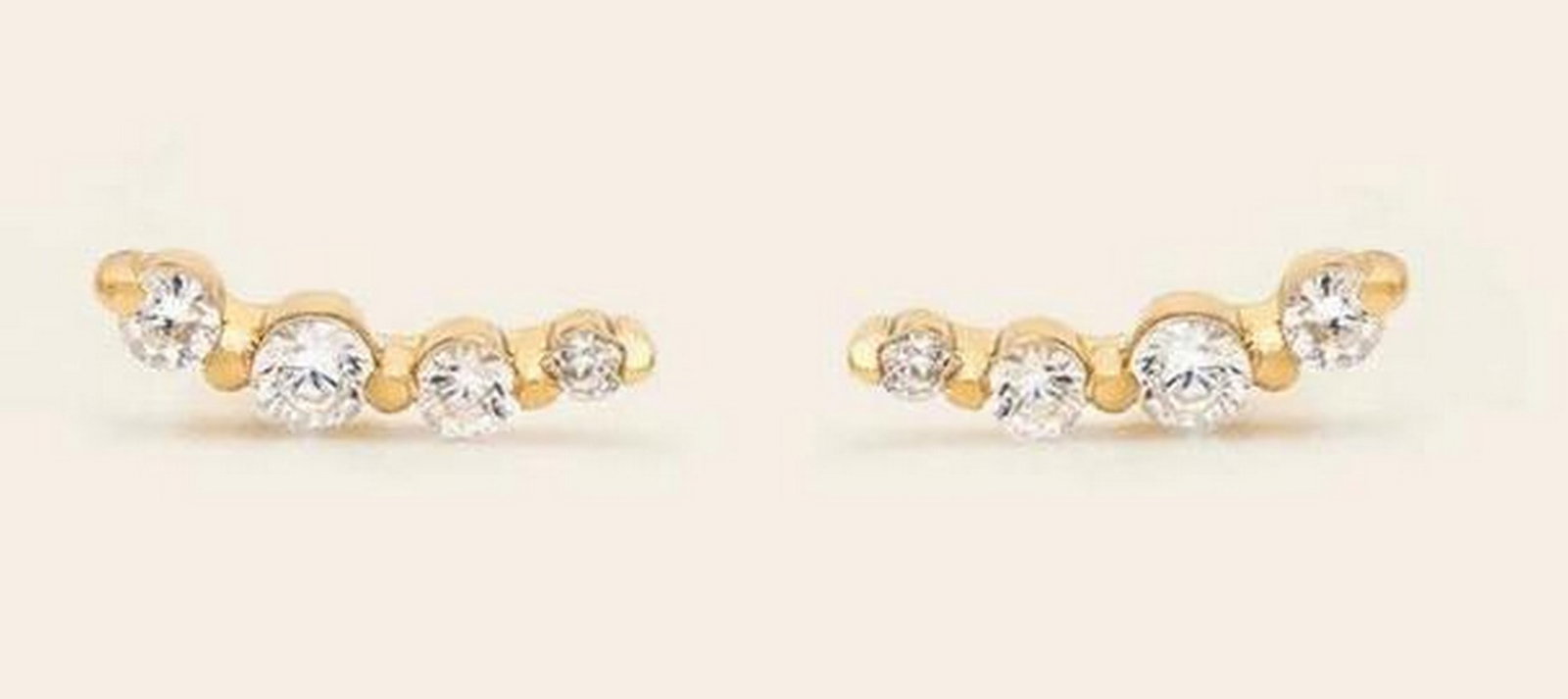 Sunrise Ear Climbers: Sunrise Ear Climbers Delicate ear climbers designed to follow the natural curve of the ear, adding subtle sparkle whether you have multiple piercings or wear them solo. Crafted in 14k gold vermeil