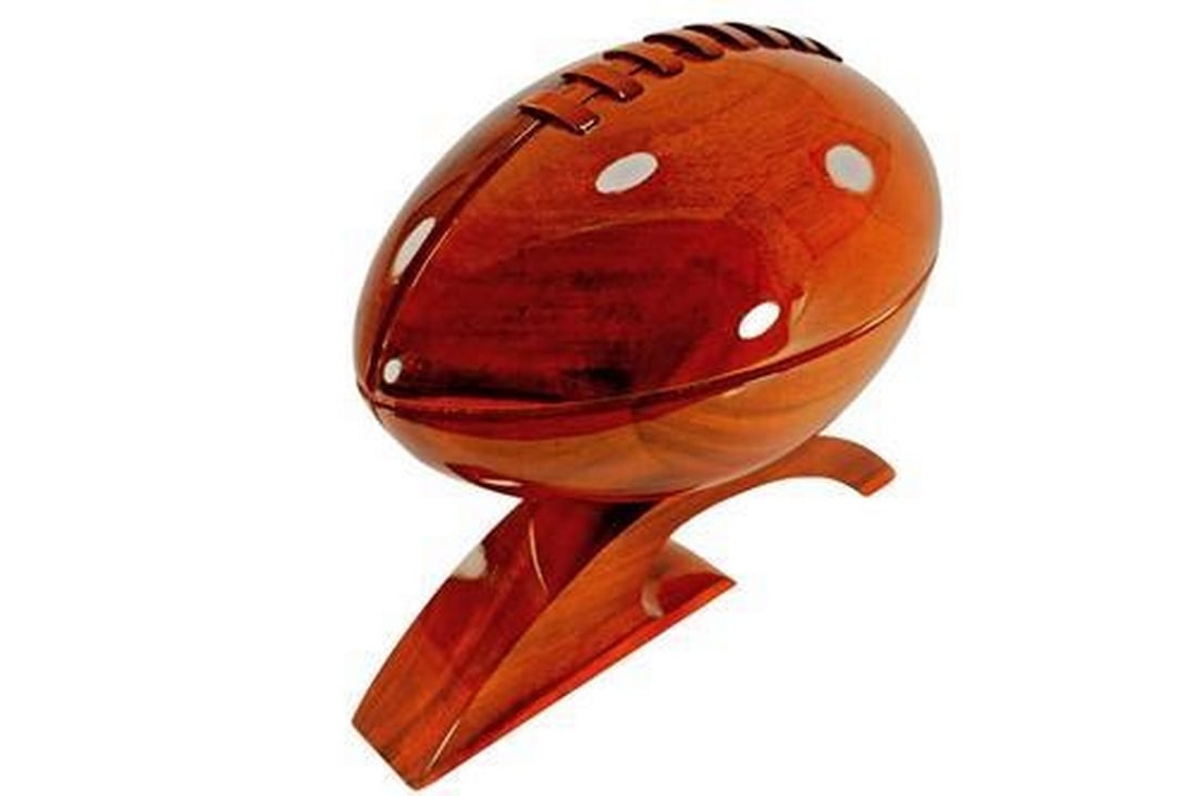Wooden Football: Wooden Football Wooden Football - Very Unique item and a perfect gift. Perfect for any Man Cave. The football is 10.5" long with a diameter of 5 1/2", 10" tall and 12" long