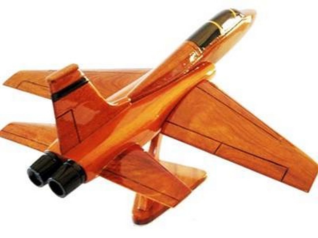 T-38 Talon: T-38 Talon This handcrafted model of the T-38 Talon is a remarkable scale replica in solid mahogany. Movable props, hand carved details, and three coats of polyurethane finish add up to an