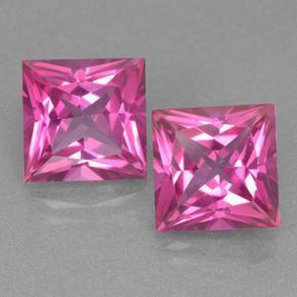 12ct Princess Cut Knockout Pink Mystic Topaz Gemstone Pair: 12ct Princess Cut Knockout Pink Mystic Topaz Gemstone Pair Individual Carat Weight: 6ct Size: 9.8mm L x 9.8mm W x 6.7mm D Shape: Princess Cut Clarity: VVS-VS Treatment: Coated Origin: Brazil Ple