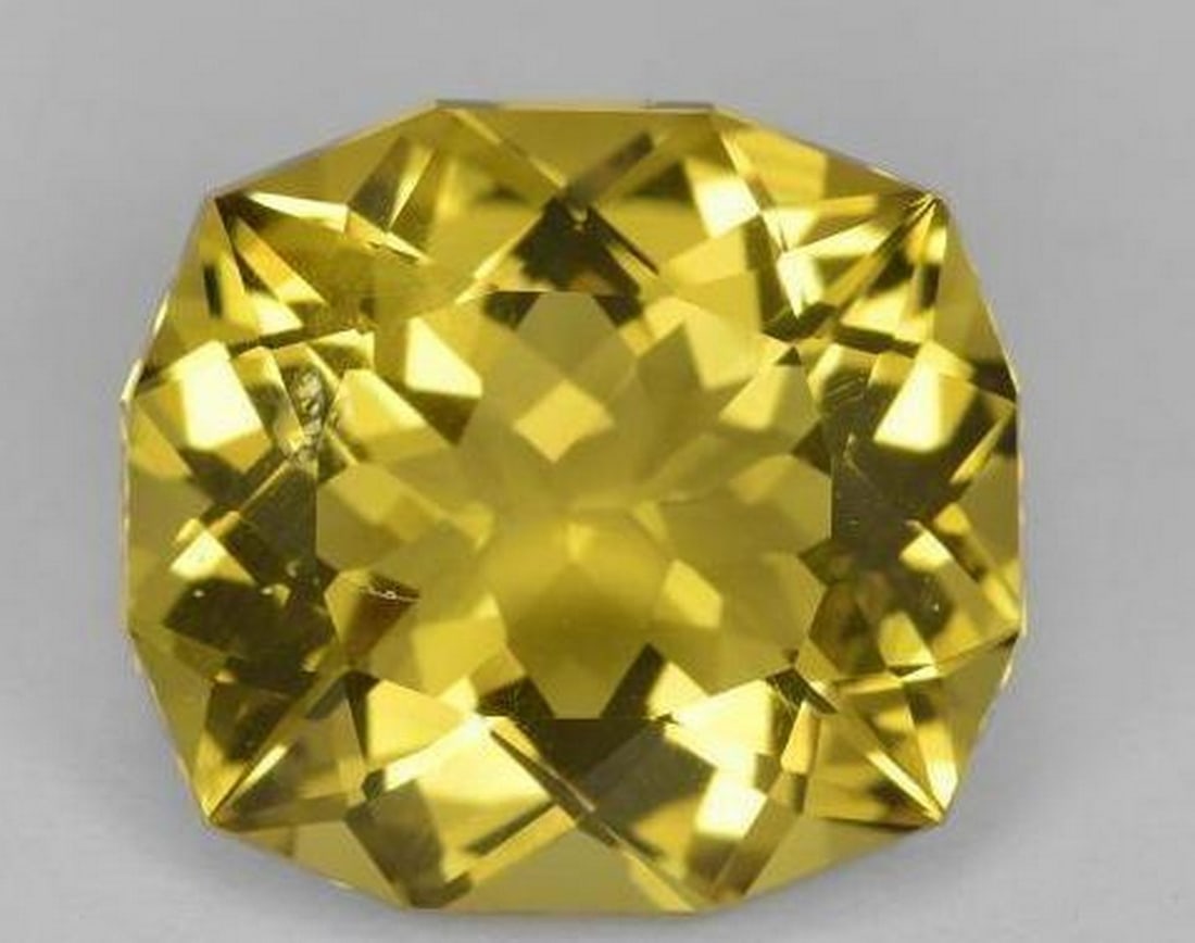 10.55 ct Cushion Cut Faceted Golden Dijon Yellow Quartz Gemstone: 10.55 ct Cushion Cut Faceted Golden Dijon Yellow Quartz Gemstone Experience the radiance of the Cushion Cut Faceted Golden Dijon Yellow Quartz Gemstone—an embodiment of warmth and sophistication. T