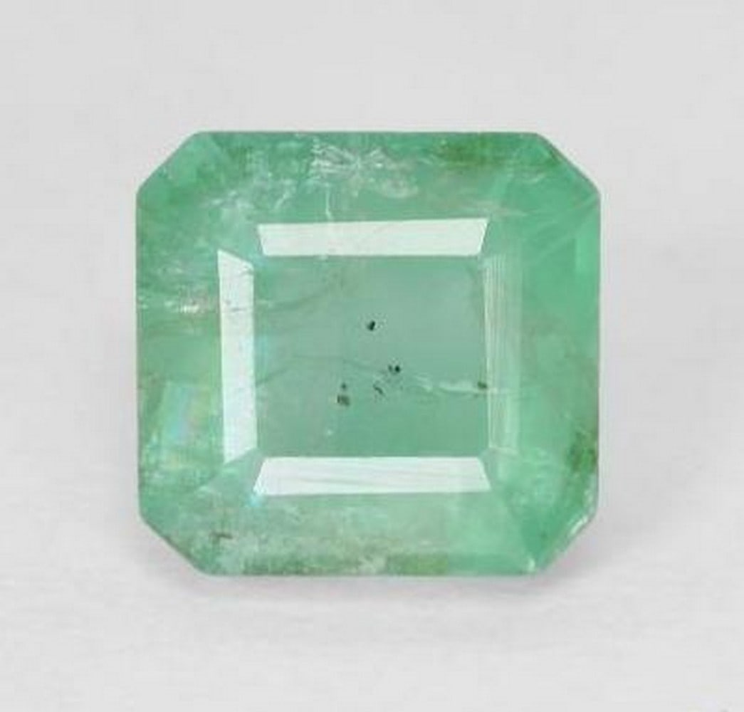 1.4ct Octagon Step Cut Mint Light Green Emerald Gemstone: 1.4ct Octagon Step Cut Mint Light Green Emerald Gemstone Introducing our 1.4ct Octagon Step Cut Mint Light Green Emerald Gemstone – a luminous masterpiece that effortlessly captures the essence of
