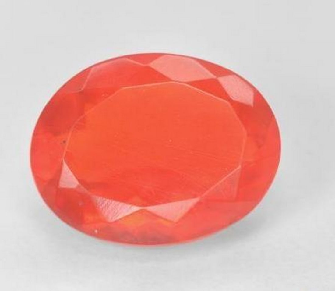 3.29 ct Oval Cut Faceted Celestial Star Fire Opal Gemstone: 3.29 ct Oval Cut Faceted Celestial Star Fire Opal Gemstone Embark on a celestial journey with the Oval Cut Faceted Celestial Star Fire Opal Gemstone—a radiant treasure that captures the essence