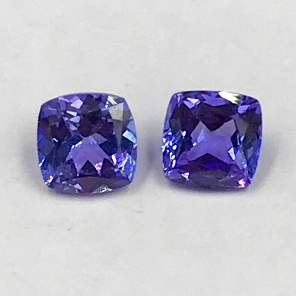 1.28ct Pair of Faceted Cushion Tanzanite Gemstones: Pair of Faceted Cushion Tanzanites Tanzanite gems are believed to represent heart and intellect combined with intuition and purity. These stones are used as symbols of dignity, truth, judgement and
