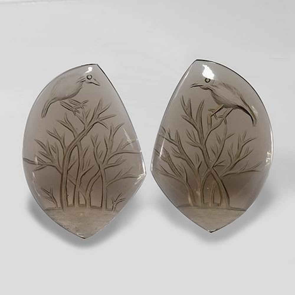 2pc Matching Fancy Brown Smoky Quartz 75.9ct Total ct Weight: 2pc Matching Fancy Brown Smoky Quartzs These matching pieces are perfect for a earing set for a loved one. Smoky Quartz brings emotional calmness to your spirit and soul. Smoky quartz helps one to re