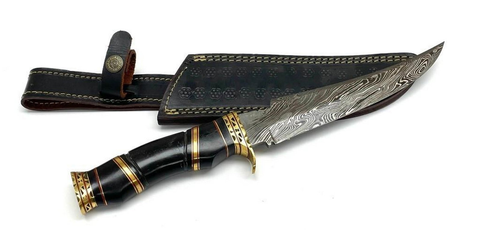 Black Ebonized And Brass Inlaid Handles Trailing Point Damascus Hunting Blade: Black Ebonized And Brass Inlaid Handles Trailing Point Damascus Hunting Blade. Blade Is Handcrafted In Great Condition. The Hunting Blade Is Also Equipped With A Genuine Leather Stitched Sheath That C