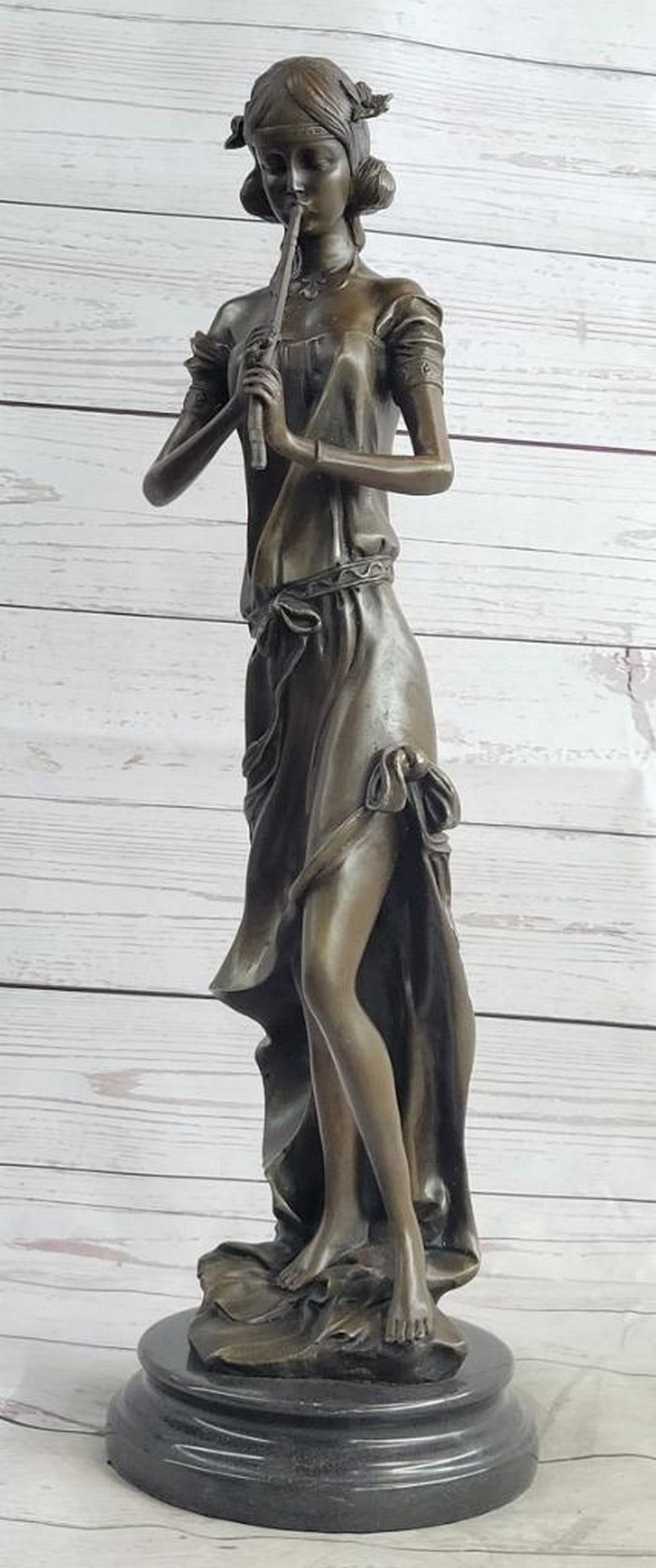 Melody of the Muse" Bronze Flute Player Sculpture by Jean Patoue - 20" x 6.5: "Melody of the Muse" Bronze Flute Player Sculpture by Jean Patoue - 20" x 6.5" A young woman plays a soothing melody on her flute, her lips gently pressed against the slender instrumen
