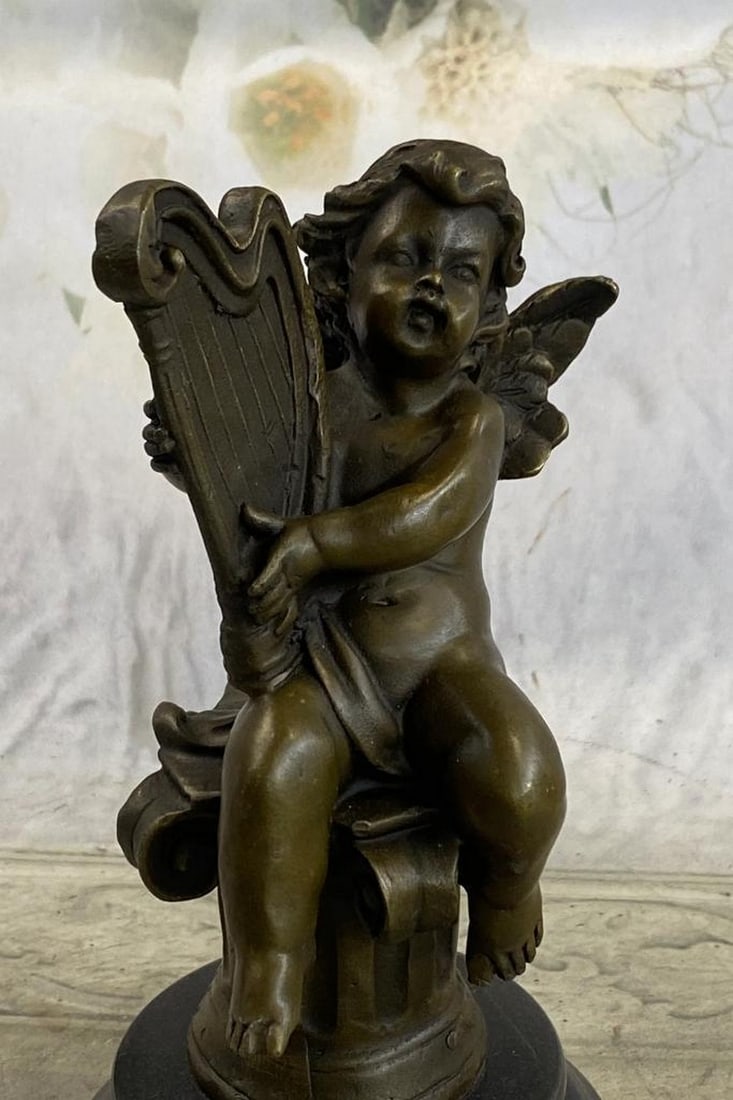 Moreau Inspired Cherub Playing Harp Bronze Sculpture On Marble Base - 8" x 5": Moreau Inspired Cherub Playing Harp Bronze Sculpture - 8" x 5" This beautiful bronze statue depicts an adorable little cherub playing the Harp . It is part of a series of cherub musicians and