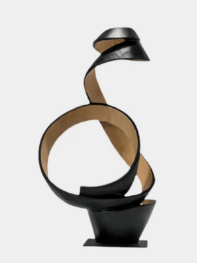 Sculpted Twisted Wood Art Piece: Sculpted Twisted Wood Art Piece This handmade wooden sculpture features a smooth, twisting design that flows upward in a spiral form. Crafted from solid wood, the piece displays a natural contrast bet