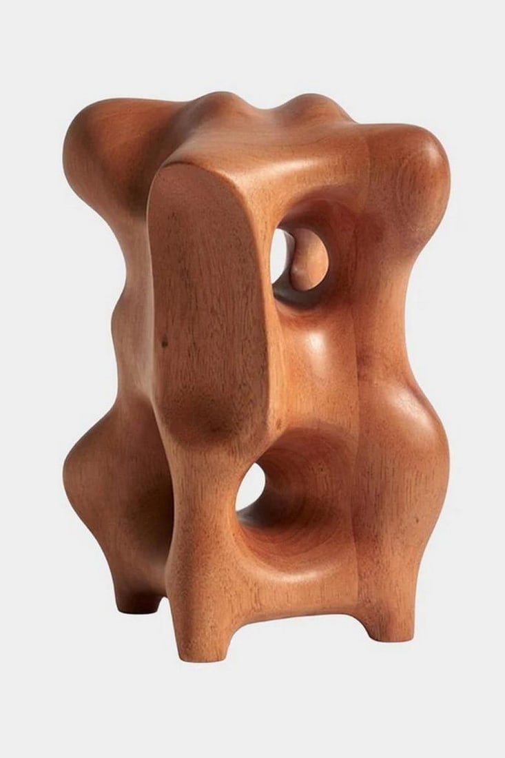 "Carved Flow" Wooden Sculpture: "Carved Flow" Wooden Sculpture This hand-carved wooden sculpture features an undulating, ribbon-like design that mimics the movement of flowing water or wind-swept fabric—an homage to moti
