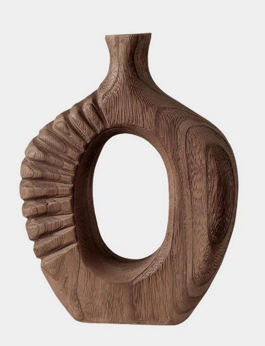 Carved Wooden Abstract Sculpture with Central Hollow: Carved Wooden Abstract Sculpture with Central Hollow This elegant one-of-a-kind sculpture is carved from richly grained wood, featuring a smooth oval silhouette with a distinctive hollow core. The asy