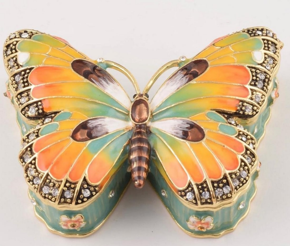 Butterfly Harmony Trinket Jewelry Box: Butterfly Harmony Trinket Jewelry Box Introducing the "Blue and Orange Butterfly Harmony Trinket Jewelry Box" – a stunning marriage of colors and nature's beauty, designed to safeguard