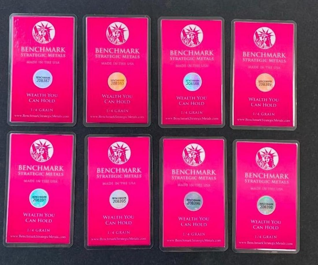 Lot of Eight Benchmark 1/4 Grain .999 Fine Gold Bars in COA Cards: Lot of Eight Benchmark 1/4 Grain .999 Fine Gold Bars in COA Cards This is a set of eight Benchmark Certificate of Authenticity cards, each containing an encapsulated 1/4 grain .999 fine gold bar.