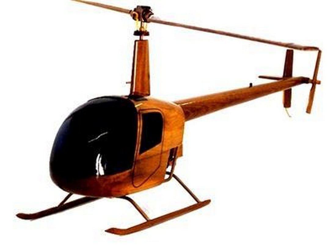 Robinson 22 Helicopter: Robinson 22 Helicopter Handcrafted from solid mahogany, this scale replica model of the Robinson 22 Helicopter has wonderful detail, high gloss and deep wood grain. Given multiple coats of polyuretha