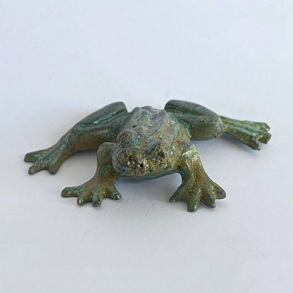 Aged Copper Frog Statuette - (0.9lbs): Aged Copper Frog Statuette - (0.9lbs) This charming frog statuette features carved detailing that highlights the natural textures and patterns of its form. Cast in copper-zinc alloy using a