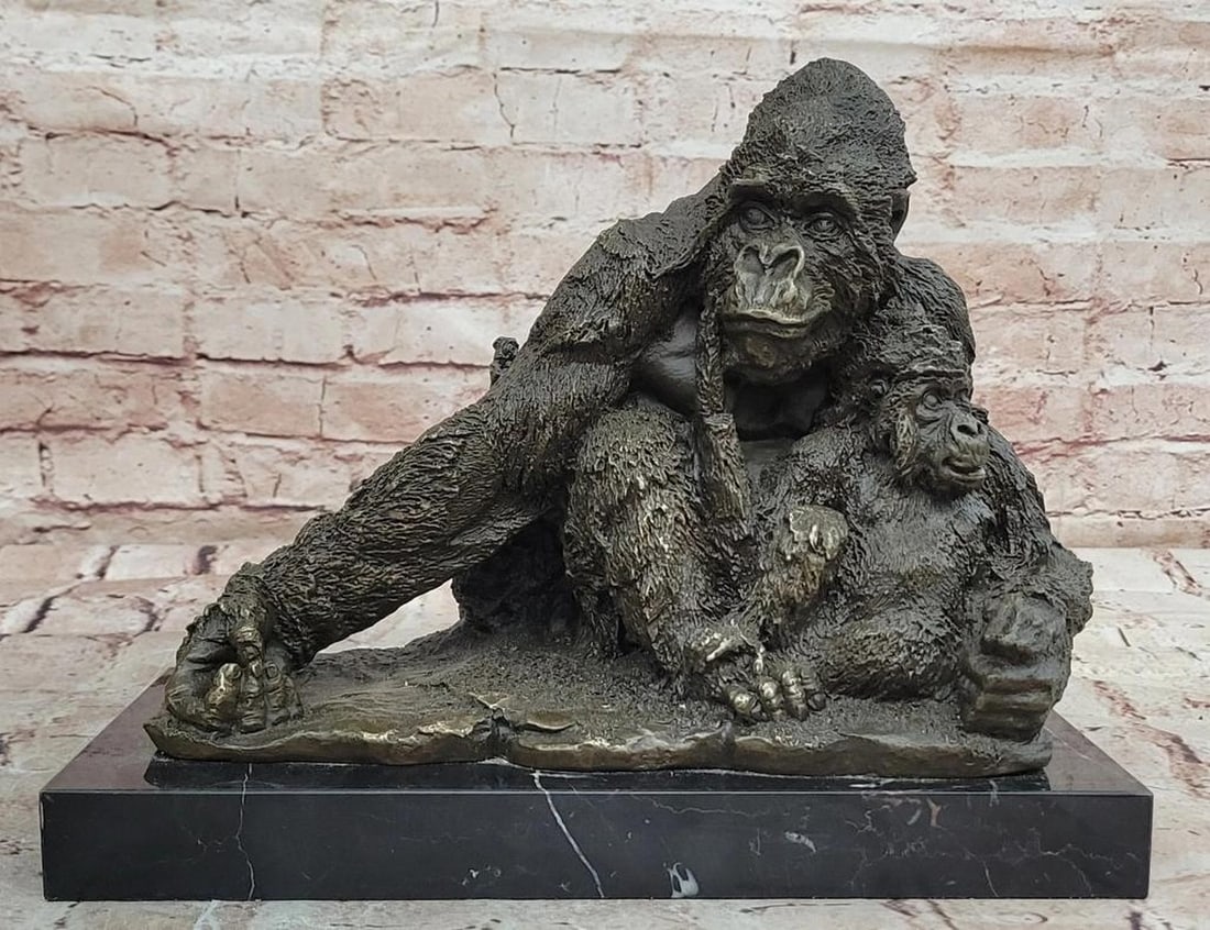 Orangutan Mother and Baby Bronze Statue – 9.5" x 11.5": Orangutan Mother and Baby Bronze Statue – 9.5" x 11.5" This original bronze statue depicts a tender moment between an orangutan mother and her baby, capturing the protective bond and