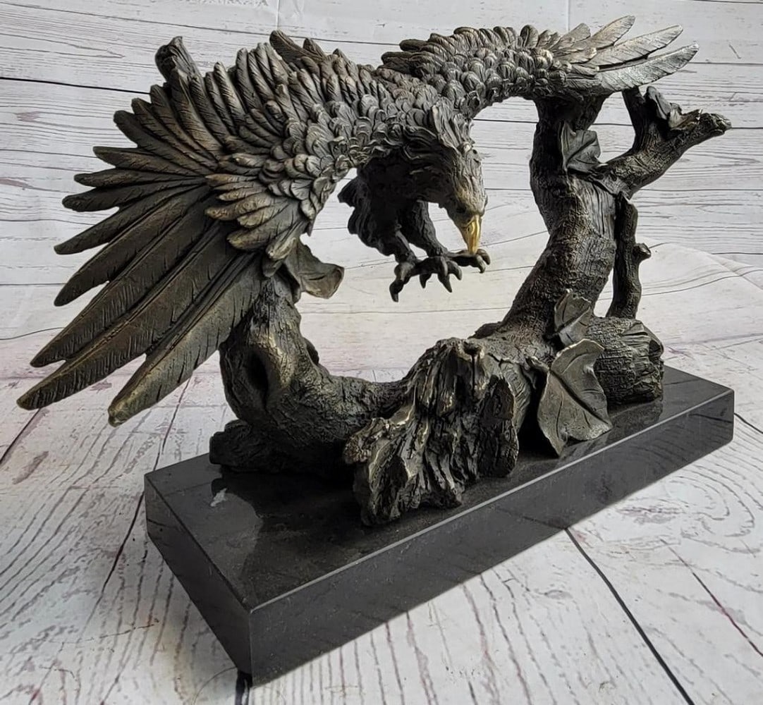 Majestic Bronze Eagle in Descent Sculpture by Milo - 9" x 17": Majestic Bronze Eagle in Descent Sculpture by Milo - 9" x 17" Experience the awe-inspiring presence of this meticulously crafted bronze sculpture depicting an eagle gracefully descending with