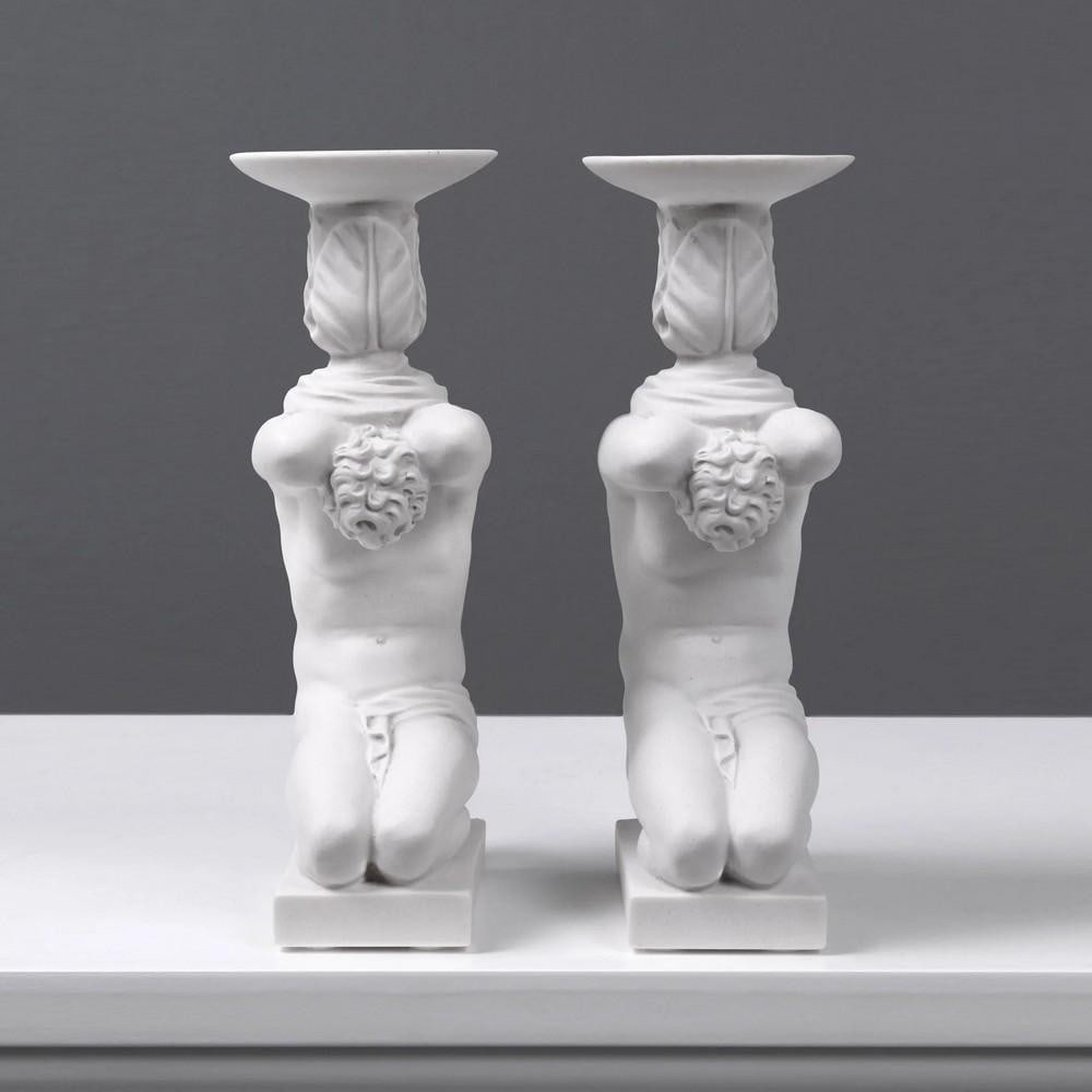 Atlas Candle Holder Sculpture Pair - (2.2lbs): Atlas Candle Holder Sculpture Pair - (2.2lbs) Illuminate your space with the timeless elegance of our Atlas candle holder sculpture pair. These exquisite pieces feature Atlas, the legendary Titan