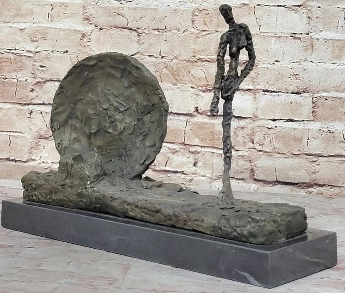 Handcrafted Woman and Wheel Bronze Sculpture: Handcrafted Woman and Wheel Bronze Sculpture A key artist in the Surrealist art movement commetti sculpted his subjects in the way that he saw them in his own mind. How, one must ask, did he see this