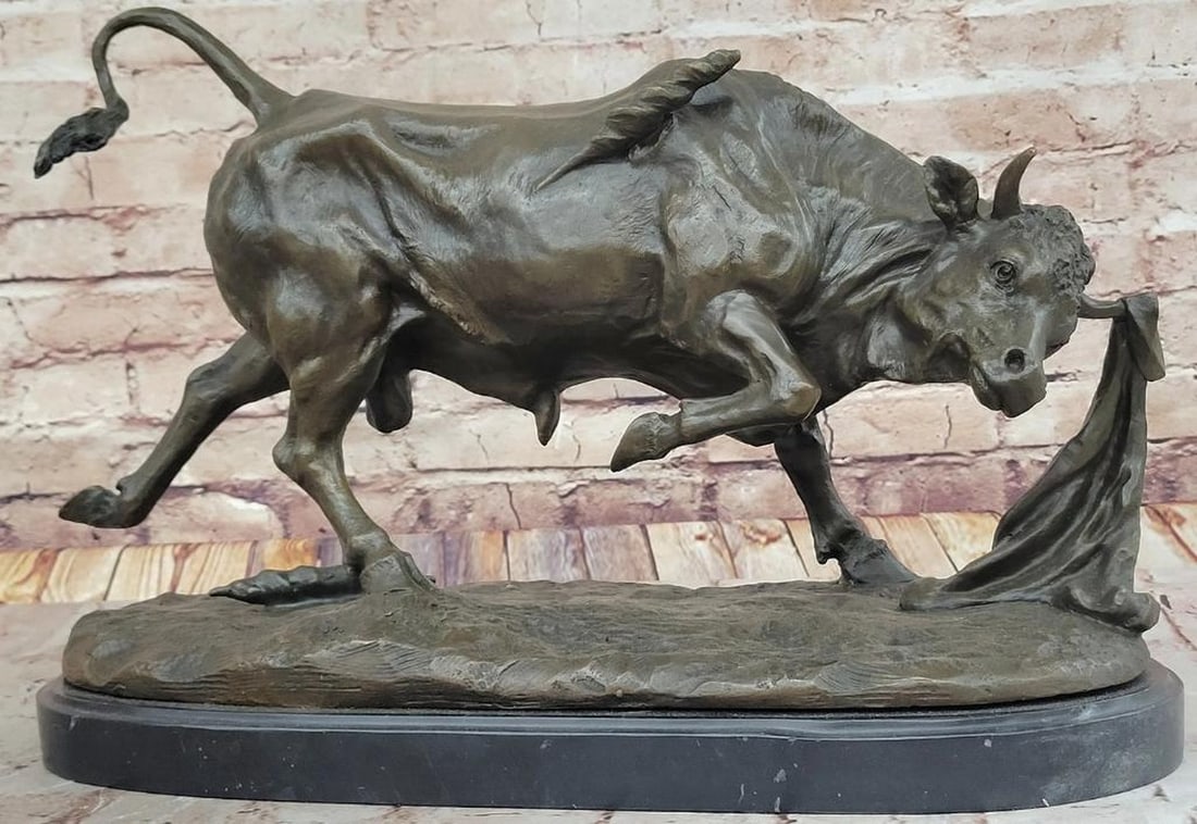 Charging Bull Bronze Sculpture Inspired by P. Comolera - 11" x 18": Charging Bull Bronze Sculpture Inspired by P. Comolera - 11" x 18" This masterfully crafted bronze sculpture captures the raw energy and determination of a charging bull, its powerful stance