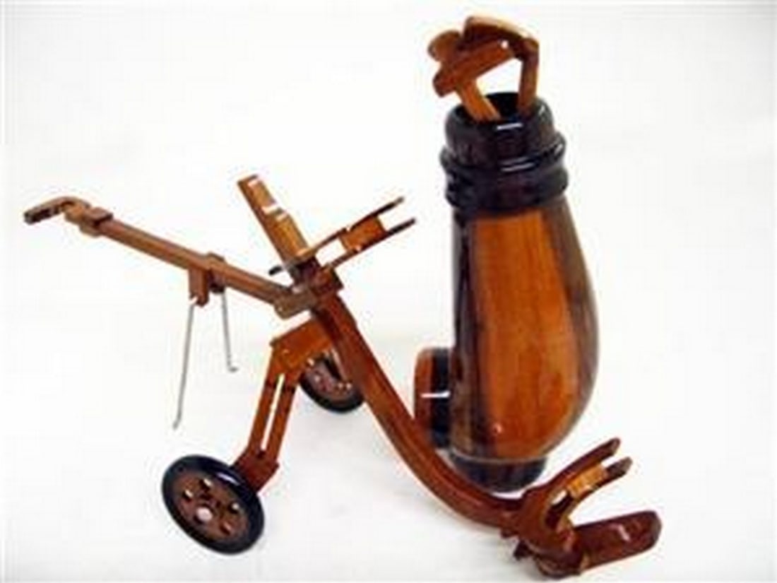 Golf Clubs: Golf Clubs Wooden Golf Clubs and Caddy set. The Golf bag and Clubs are removable from the Caddy. Dimensions: Caddy 9.5" long, Bag 5.5" tall and the Golf Clubs are 6" long View
