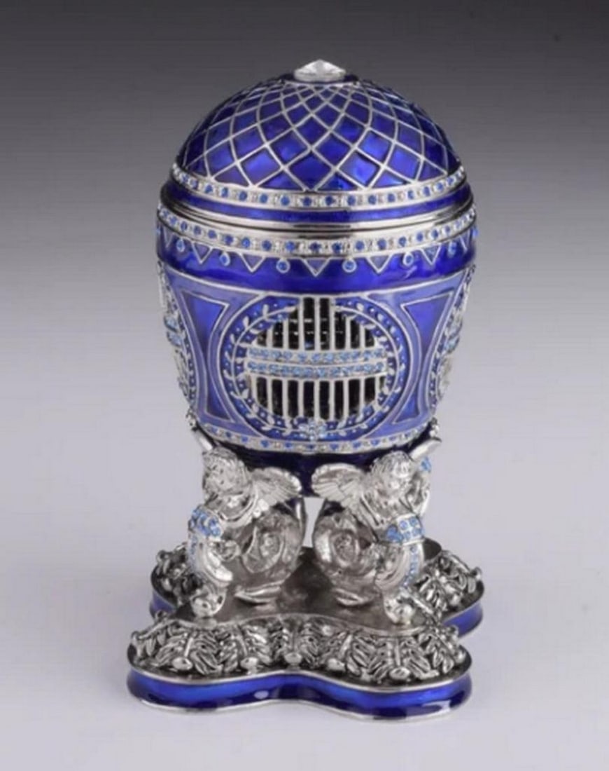 Blue Russian Egg with Hidden Horseback Rider Trinket Box: Blue Russian Egg with Hidden Horseback Rider Trinket Box This splendid handmade Blue Russian Egg trinket box, featuring a Man Riding Horse surprise inside, is a one-of-a-kind piece designed for art