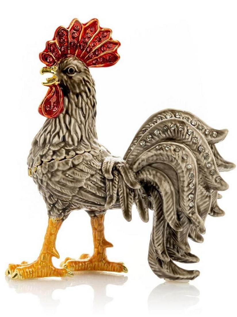 Gray Rooster Trinket Box: Gray Rooster Trinket Box This elegant handmade trinket box features a rooster adorned with rich gray enamel, golden accents, and a vibrant red crown accented with sparkling crystals. The hinged design