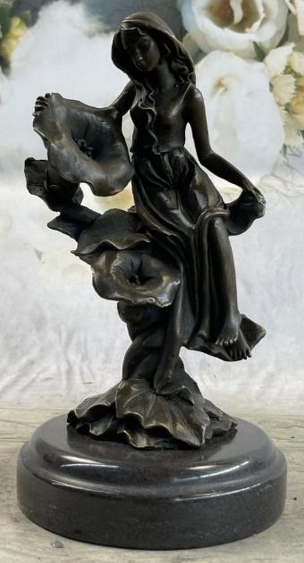 Girl Resting on Flower Bronze Sculpture: Girl Resting on Flower Bronze Sculpture Get lost in a daydream. She leans back on a tree stump and flowers grow all around her. She stretches an arm out to feel the blossom graze her skin. She is