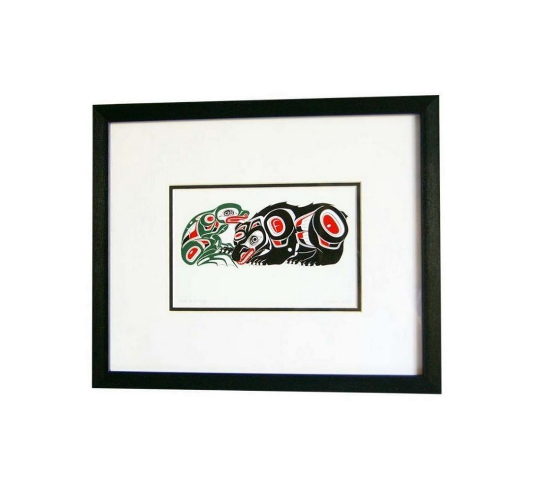 Friendly Encounters: Bear and Frog Framed Print - 12" x 14": Friendly Encounters: Bear and Frog Framed Print - 12" x 14" Invite the charm of the wild into your space with our "Friendly Encounters: Bear and Frog" print. This captivating artwork