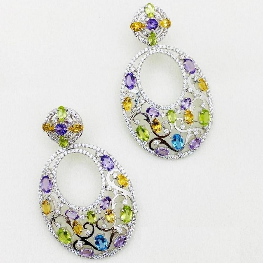Studded Amethyst, Peridot, Citrine, Blue Topaz and Zirconia on 925 Sterling Silver Earrings: Studded Amethyst, Peridot, Citrine, Blue Topaz and Zirconia on 925 Sterling Silver Earrings These earrings feature Amethyst, Peridot, Citrine, Blue Topaz and Zirconia placed delicately on wreath