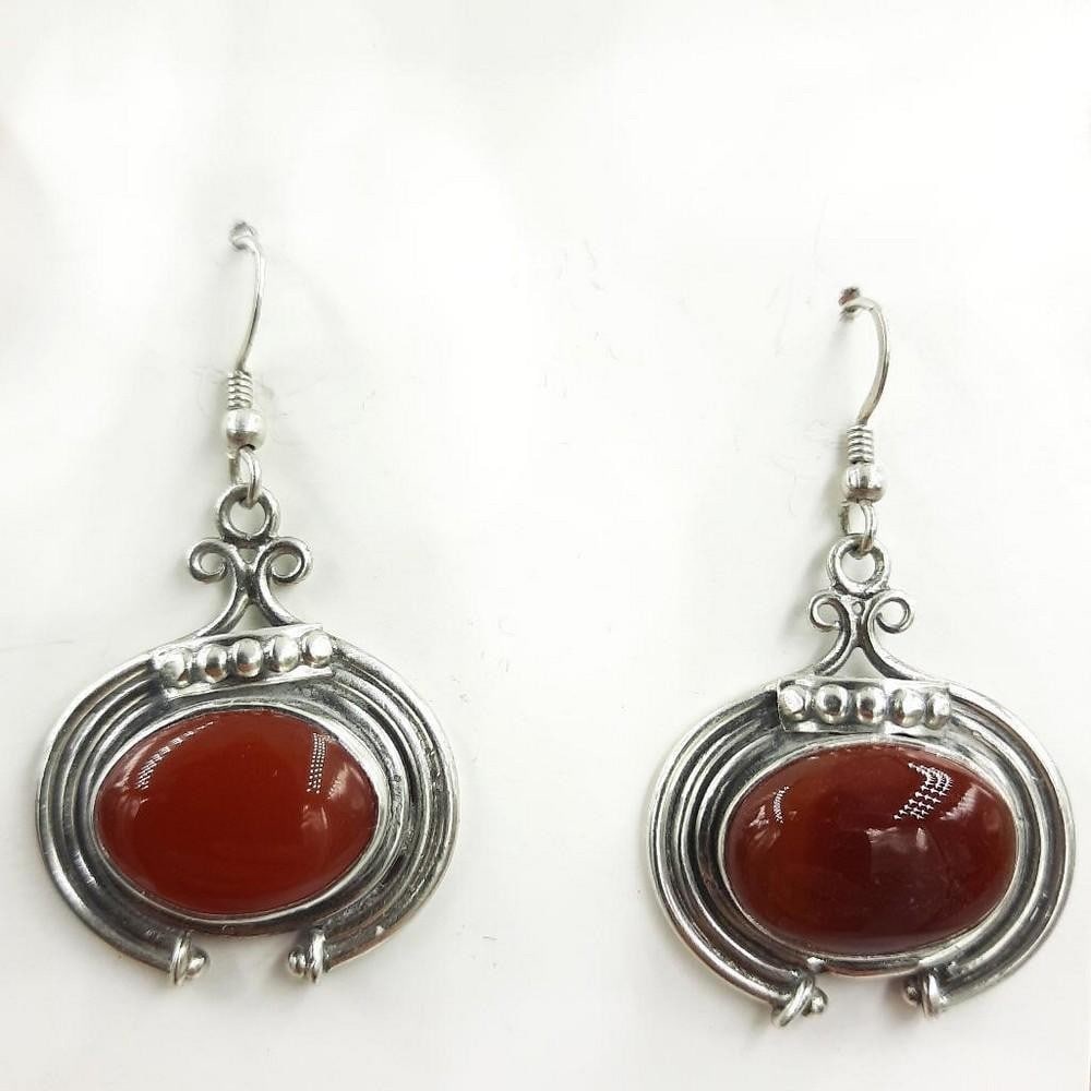 Encased Red Agate Oval Cabochon Earrings: Encased Red Agate Oval Cabochon Earrings Red agate is tied to passion, self love, and perseverance. Agate is liked to bright ideas and positive thinking, symbolizing harmony and rebalance. View