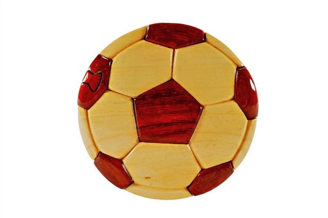 Mahogany Soccer Keepsake Box: Mahogany Soccer Keepsake Box This keepsake box is hand-crafted from Philippines mahogany and features a soccer design on the exterior, with a red velvet-lined interior for storing small items. The box