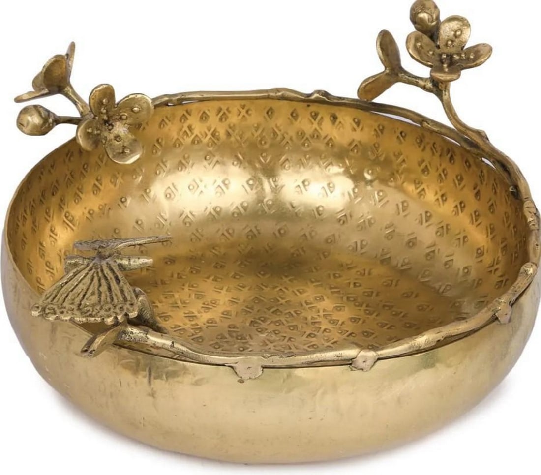 Butterfly Brass Urli Bowl: Butterfly Brass Urli Bowl Butterflies symbolize transformation, hope and rebirth. This brass Urli is adorned with beautiful butterflies and the inner wall of the Urli has a matt polish. The entire Ur