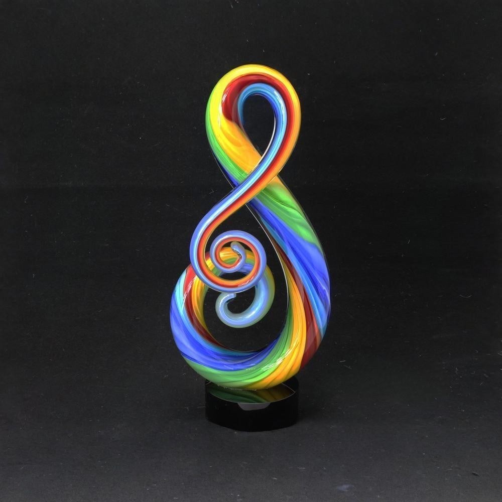 Rainbow Glass ‘Arcobaleno’ by Mirhò: Rainbow Glass ‘Arcobaleno’ by Mirhò This glass sculpture by Mirhò features vibrant, layered colors that flow seamlessly to create depth and a sense of movement. The piece captures light differe