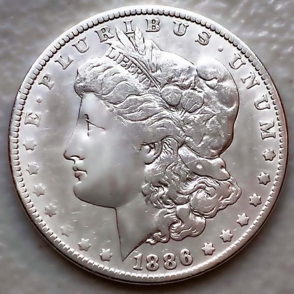 1886 MORGAN SILVER DOLLAR: 1886 MORGAN SILVER DOLLAR Certification: Uncertified Circulated/Uncirculated: Circulated Year: 1886 Composition: 900 Silver Mint Location:Philadelphia Deno