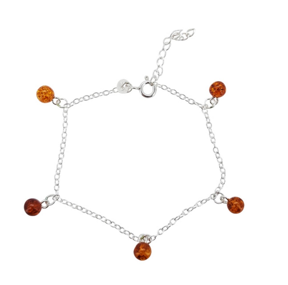 Amber Balls of Elegance Sterling Silver Bracelet: Amber Balls of Elegance Sterling Silver Bracelet Each delicate ball of amber, with its unique hues ranging from warm honey to rich cognac, adds a touch of organic elegance to the piece. The sterling