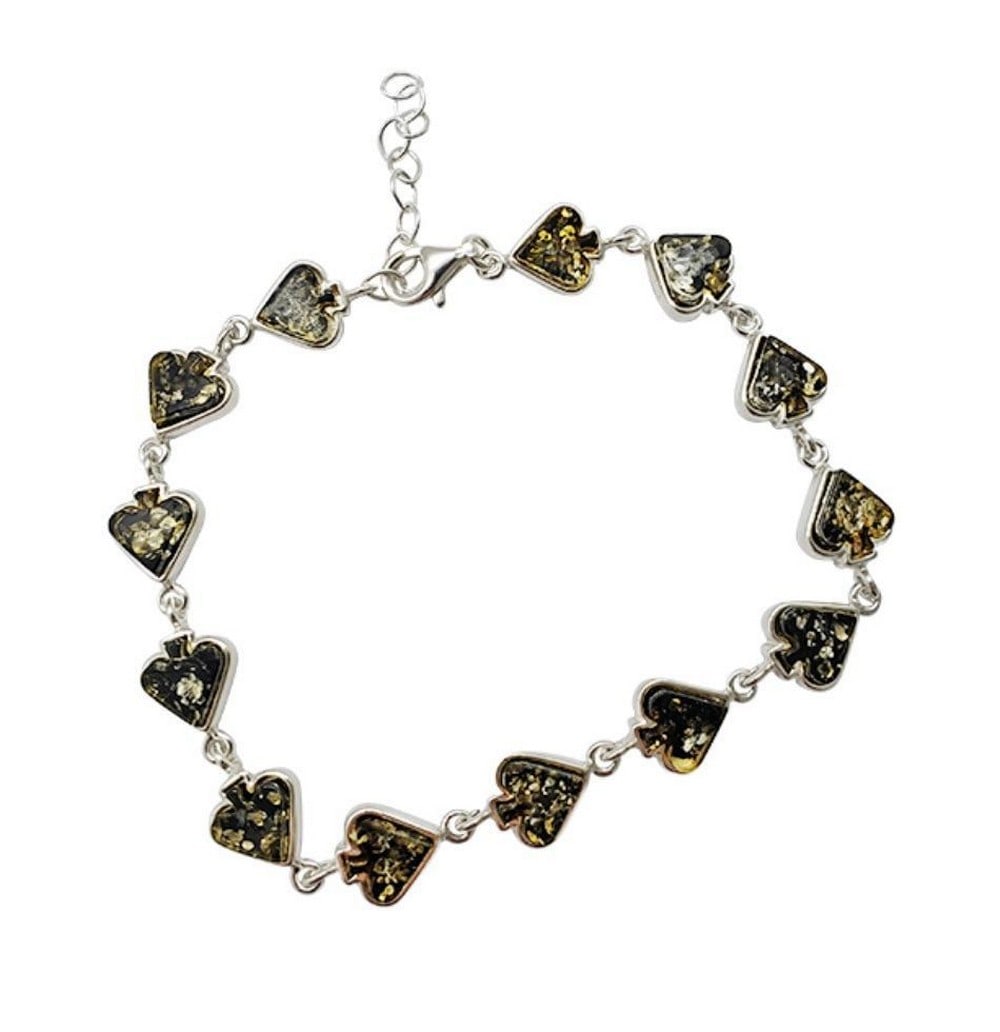 Spade Green Amber Sterling Silver Link Bracelet: Spade Green Amber Sterling Silver Link Bracelet Crafted with meticulous attention to detail, this bracelet showcases the captivating allure of green amber nestled within polished sterling silver spad