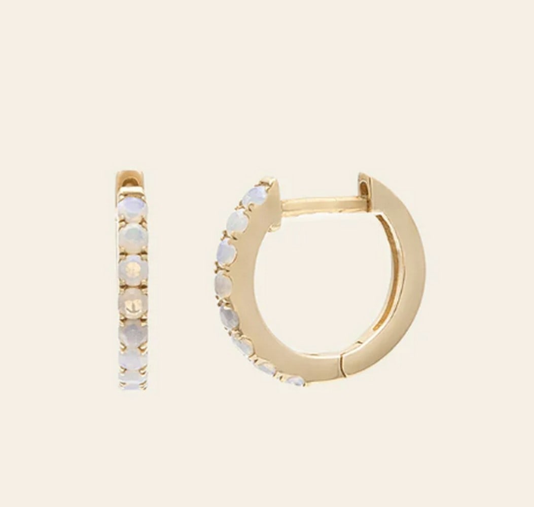 10k Solid Gold & Australian Opal Earrings: 10k Solid Gold & Australian Opal Earrings These 10K solid gold earrings feature luminous Australian opals, celebrated for their mesmerizing play of color. Set in a timeless design, the vibrant gem