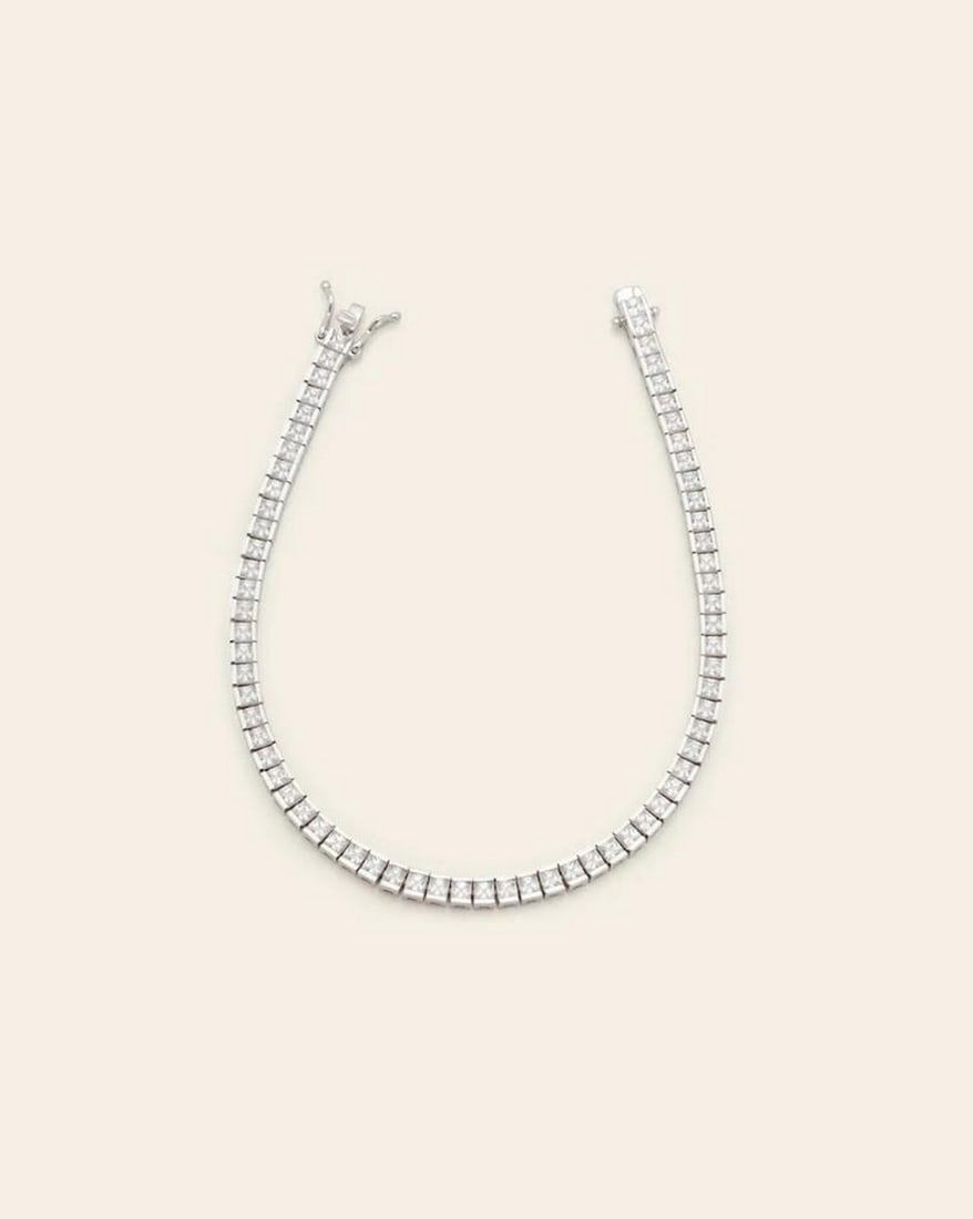 2.5mm Channel Set Tennis Bracelet in Sterling Silver: 2.5mm Channel Set Tennis Bracelet in Sterling Silver A true classic, designed with a channel setting and a detailed box clasp. This bracelet is sure to sparkle no matter how you wear it. Sterling Sil