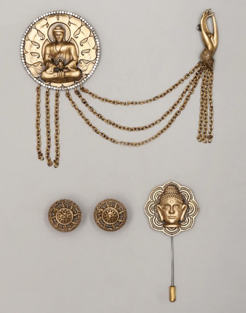 Divine Buddha Brooch and Sun Cufflinks Set: Divine Buddha Brooch and Sun Cufflinks Set This unique jewelry set blends spiritual symbolism with wearable art, crafted from lustrous brass for a sophisticated touch. It includes a statement brooch,
