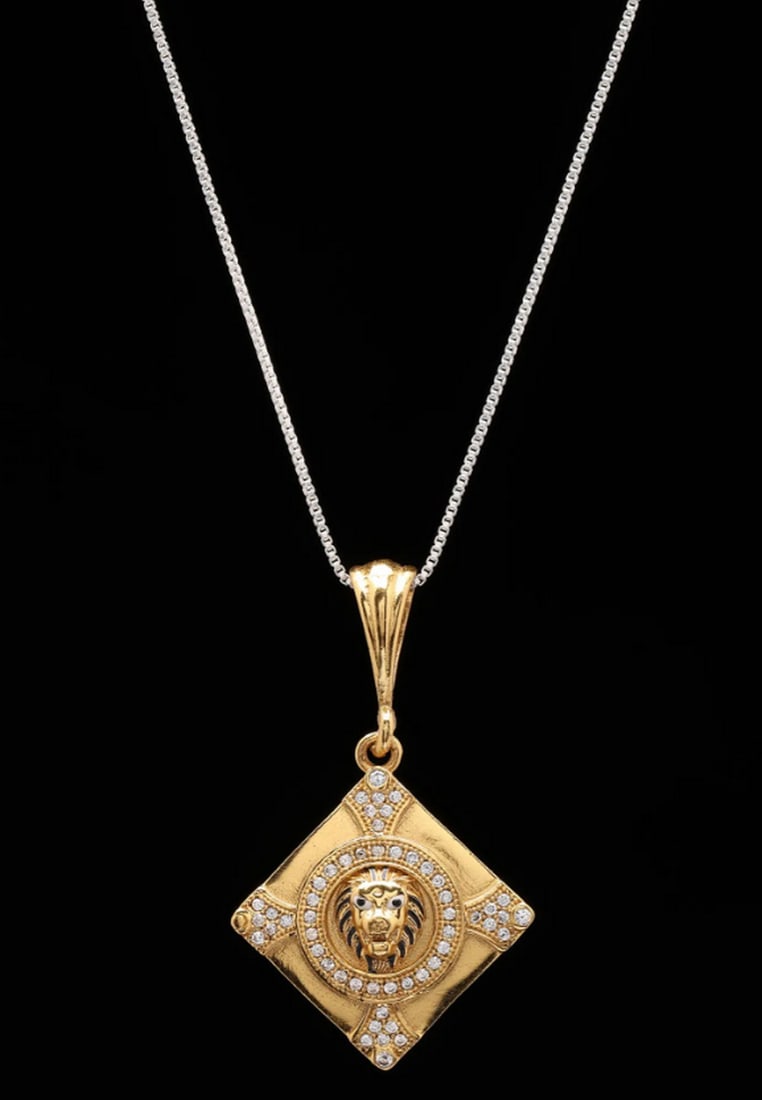 Kite Shaped Brass Lion Pendant: Kite Shaped Brass Lion Pendant This brass pendant features a striking kite-shaped design with a detailed lion motif at its center, symbolizing strength, courage, and majesty. The geometric shape combi