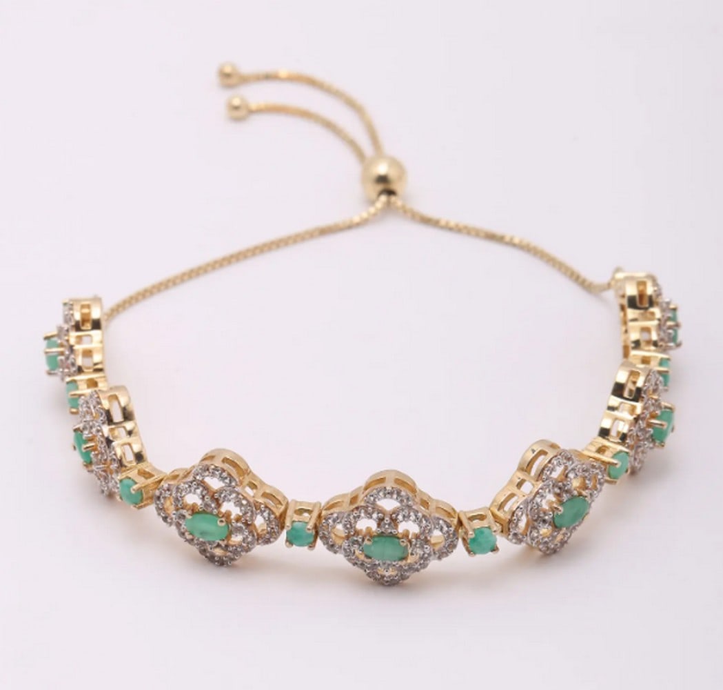 Floral Design Emerald and White Topaz Wraparound Bracelet in Sterling Silver – 11.5": Floral Design Emerald and White Topaz Wraparound Bracelet in Sterling Silver – 11.5" This elegant wraparound bracelet features floral-inspired sterling silver links adorned with vibrant emeralds