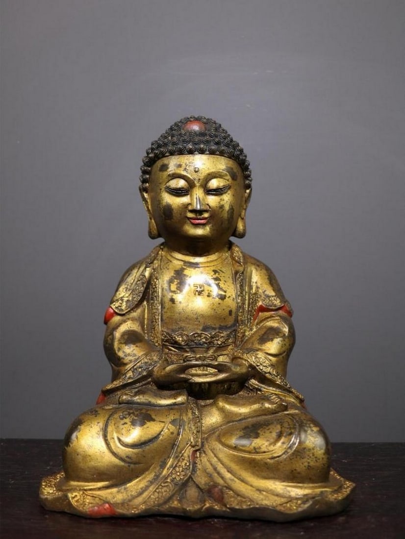 Antique Chinese Copper Sakyamuni Buddha Statue: Antique Chinese Copper Sakyamuni Buddha Statue A rare and meticulously handcrafted Sakyamuni Buddha statue, made from pure copper with intricate detailing. This exquisite piece captures the serene pr