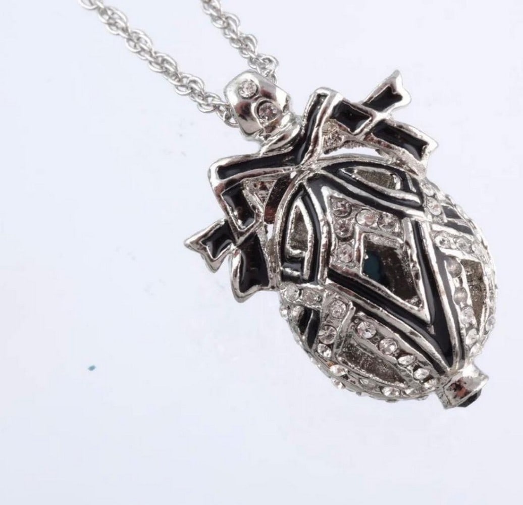 Black Bow Austrian Crystal Egg Pendant: Black Bow Austrian Crystal Egg Pendant This egg pendant is a great gift for a loved one or for yourself. It is such a unique present it is made for art lovers who get inspired by beautiful things. Th
