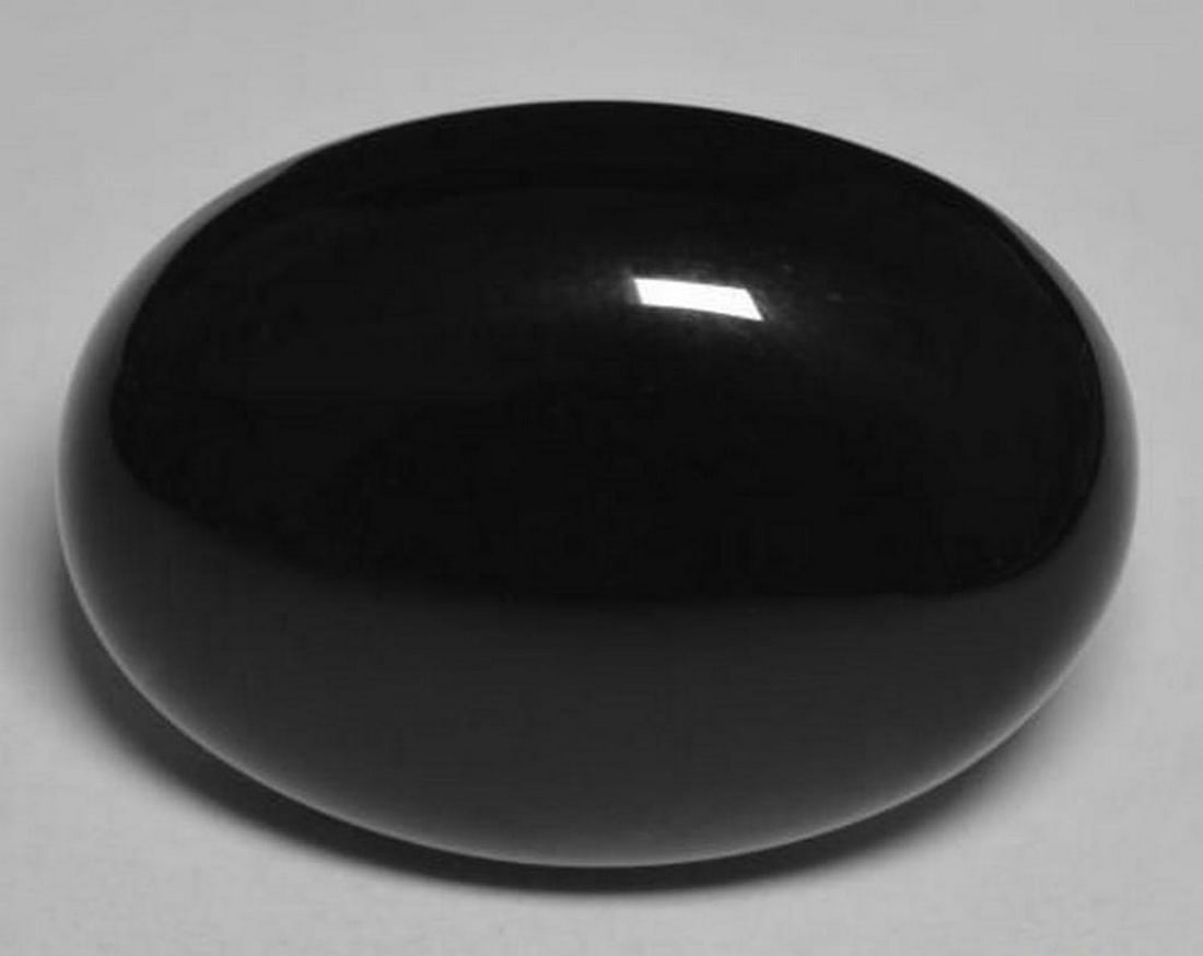 20.8ct Oval Cabochon Deep Black Onyx Gemstone: 20.8ct Oval Cabochon Deep Black Onyx Gemstone Type: Onyx Weight: 20.88 ct 1 gem Size: 22.1 x 15.8 x 7.3 mm Exact Size: 22.06 x 15.81 x 7.25 mm Shape: Oval Cabochon Color: Black Clarity: Opaque Tr
