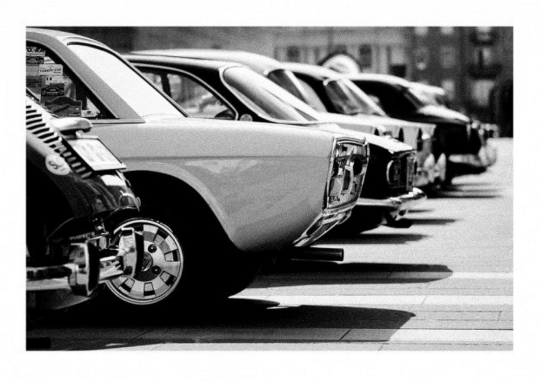 Black & White Vintage Cars Poster: Black & White Vintage Cars Poster Vintage retro cars. Black and white photograph of a line of retro vintage cars in a parking lot. Photograph in black and white of retro cars standing in a line.