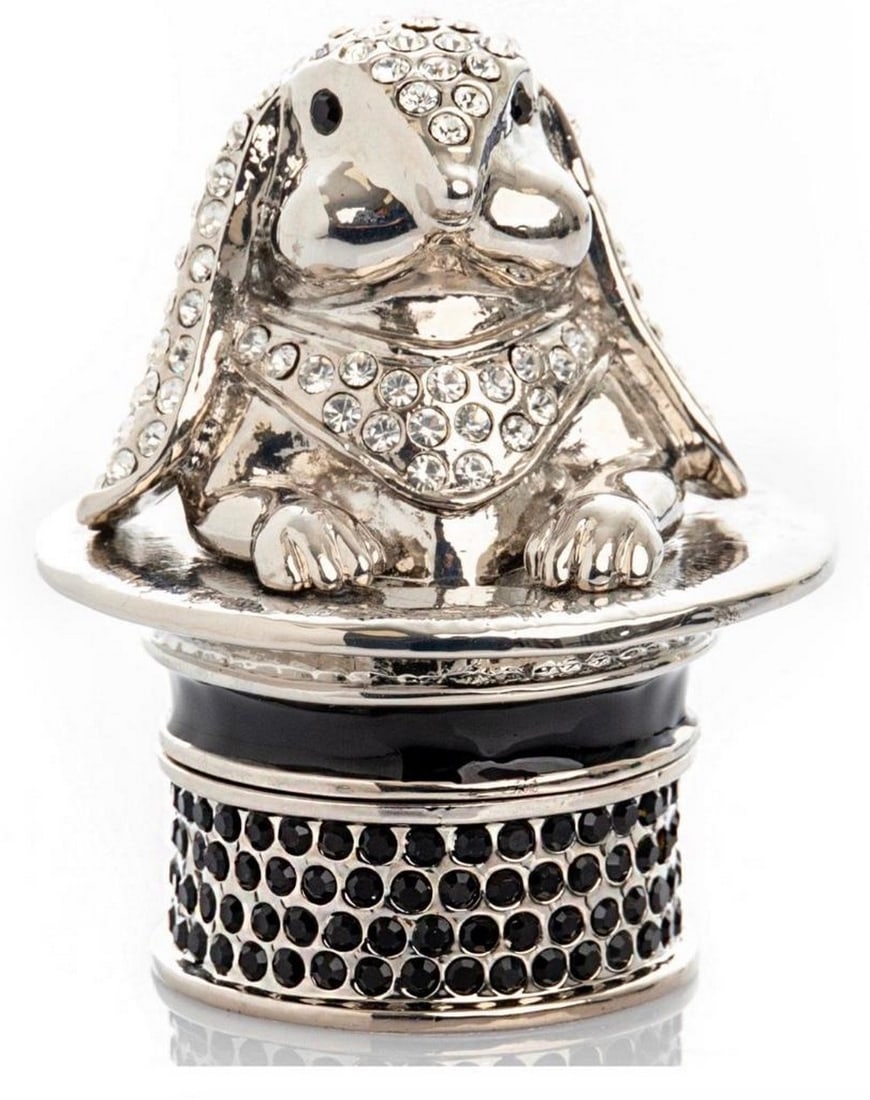 Bunny in a Hat Trinket Box: Bunny in a Hat Trinket Box This hand painted trinket box features Austrian crystals covering both the bunny and the hat. It has a magnetic fastener to secure closure. Dimensions: 2.72"H x 1.8