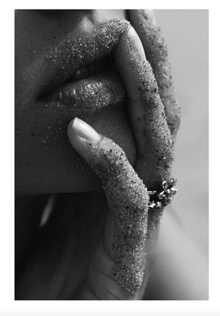 Black & White Sandy Lips Poster Print: Black & White Sandy Lips Poster Print Close up black and white photograph of a woman with sandy lips and sandy fingers Photograph in black and white of a woman holding her fingers covered in sand