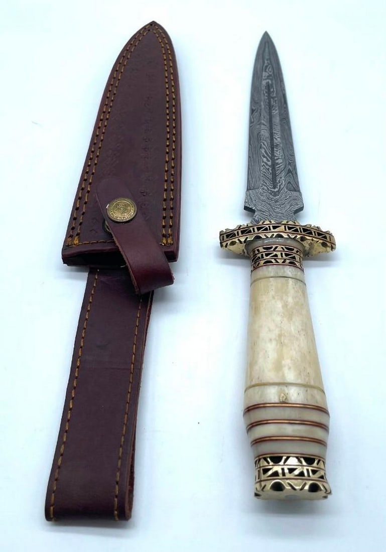 Bone Handled Damascus Shiv Point Dagger: Bone Handled Damascus Shiv Point Dagger. Damascus Steel Blade with 256 Layers on it. HARDNESS 56-60 H R C VERY HIGH QUALITY GENUINE LEATHER SHEATH View Photos For Further Details.