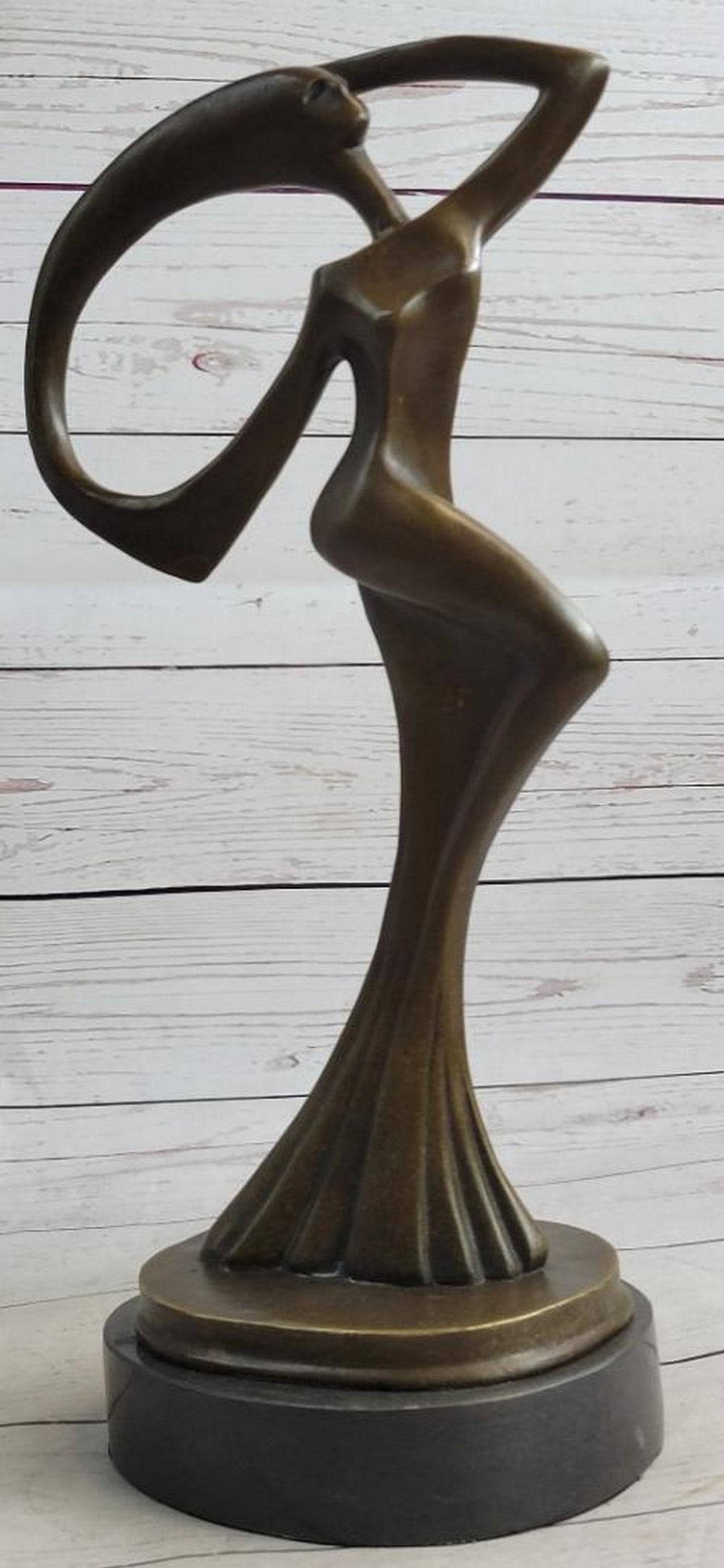 Fluid Grace" Bronze Sculpture by Milo - 14" x 7: "Fluid Grace" Bronze Sculpture by Milo - 14" x 7" "Fluid Grace" by Milo is an exquisite bronze sculpture that transcends traditional boundaries, capturing the essence of a fema